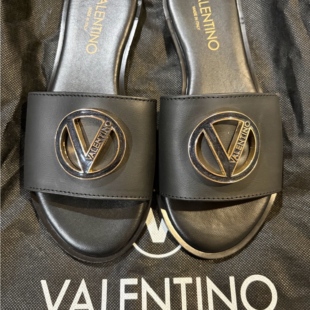 Valentino Black and Gold Logo Slides